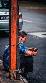 Man using mobile phone in car