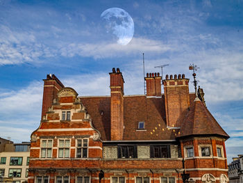 Buildings in city against sky