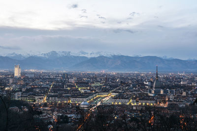 High angle view of city against cloudy sky