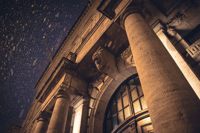 Low angle view of historical building at night