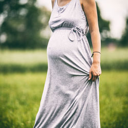 Woman standing on grass