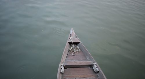 High angle view of boat sailing on pier over lake