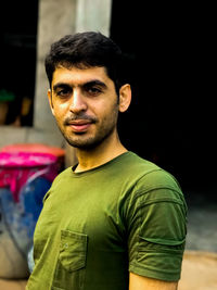 Portrait of young man standing outdoors