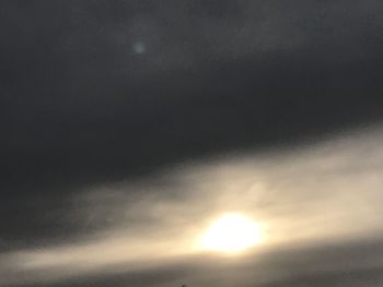 Low angle view of moon at sunset