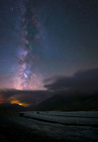 Scenic view of star field against sky at night