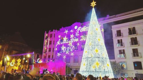 Low angle view of illuminated christmas lights