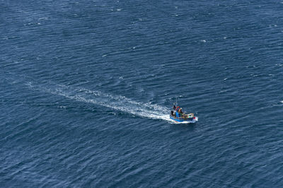 High angle view of boat in calm blue sea