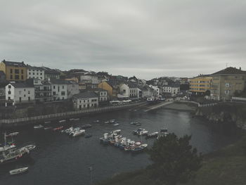 High angle view of canal with buildings in background