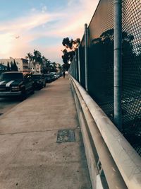 View of city street at sunset