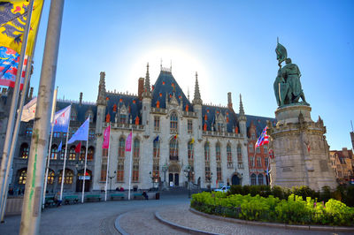 Statue of historic building against sky in city