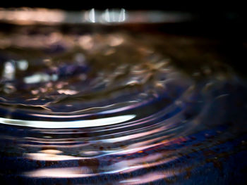 Close-up of drop falling in water