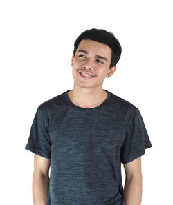 Portrait of a smiling young man against white background