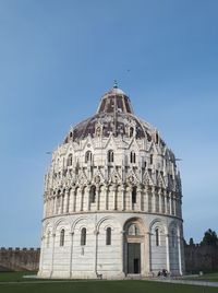 Low angle view of historical building against clear blue sky