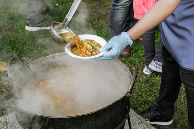 Romanian traditional food prepared at the cauldron on the open fire