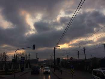 Cars on road at sunset