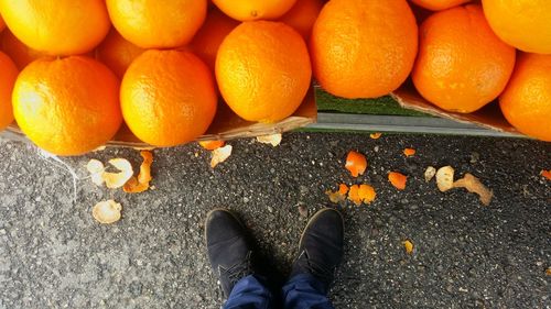 Low section of man standing on orange