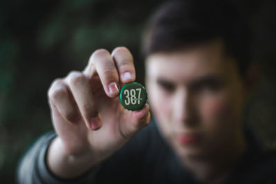 Close-up portrait of man holding hands