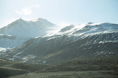 Scenic view of mountains against sky during winter