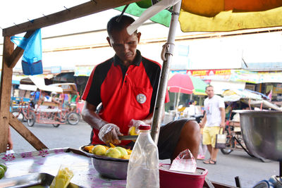 Man working at market stall