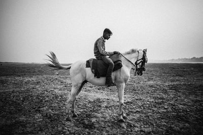 Man riding horse