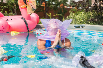 Woman swimming in pool