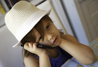 Portrait of cute girl wearing hat