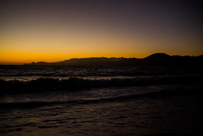 Scenic view of sea against clear sky during sunset