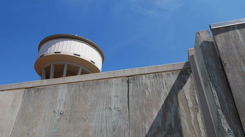 Low angle view of water tower against sky