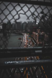 High angle view of railroad tracks by buildings in city