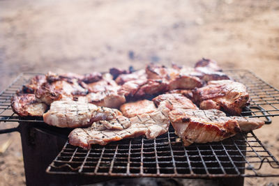 Close-up of meat on barbecue grill