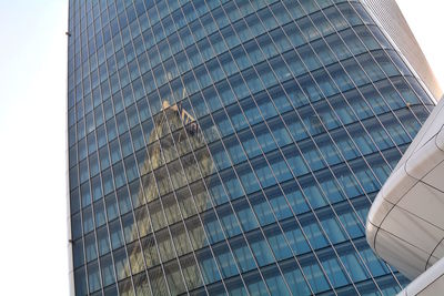 Low angle view of modern buildings against sky in city