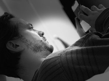 Close-up portrait of young man at home
