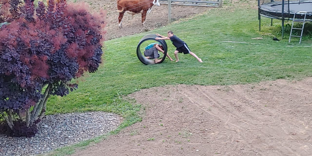 FULL LENGTH OF MAN RIDING BICYCLE ON STREET