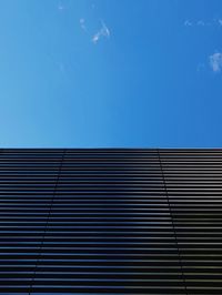 Low angle view of building against blue sky