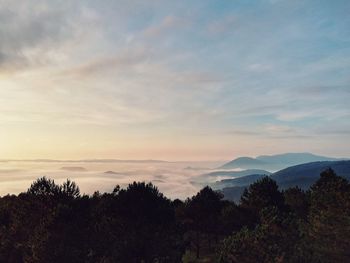 Scenic view of mountains against sky during sunset