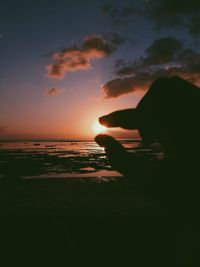 Scenic view of sea against sky at sunset