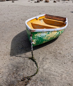 High angle view of boat moored on beach