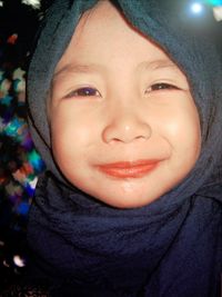 Portrait of happy girl in hijab