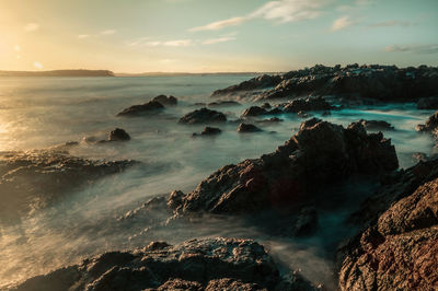 Scenic view of sea against sky at sunset