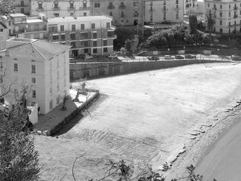 High angle view of snow covered buildings in city