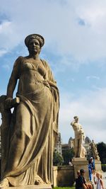 Low angle view of statue against sky