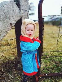 Close-up of baby boy on field