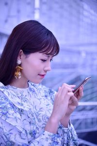 Young woman using mobile phone