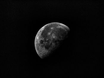 Low angle view of half moon against sky at night