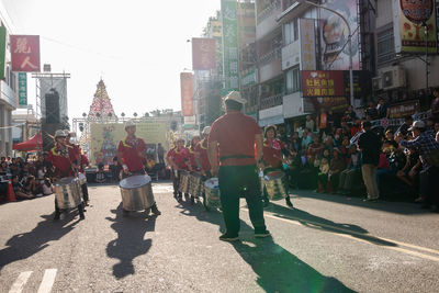 People walking on street in city