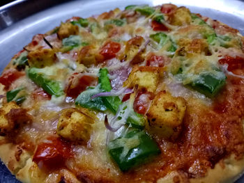 Close-up of pizza served in plate