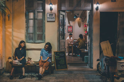 Young woman sitting outdoors