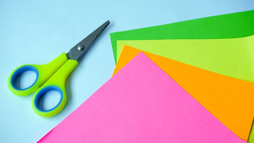High angle view of multi colored paper on table