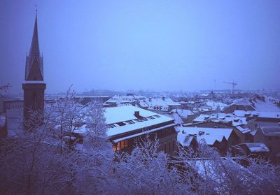 Houses against sky during winter