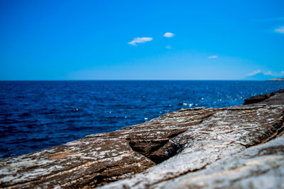 Close-up of sea against blue sky